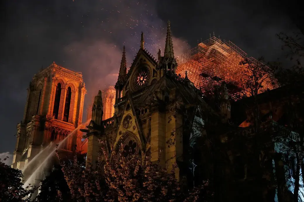 Notre Dame Cathedral burns in Paris, France, April 15, 2019. REUTERS/Philippe Wojazer